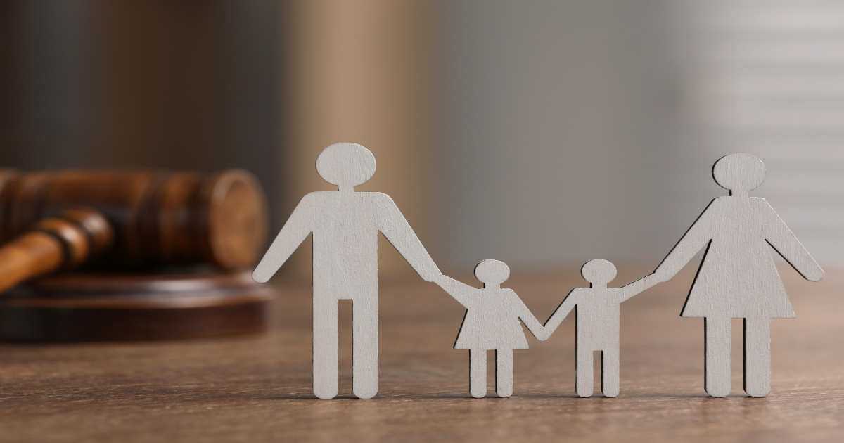 Silhouette Of A Family In Front Of A Gavel